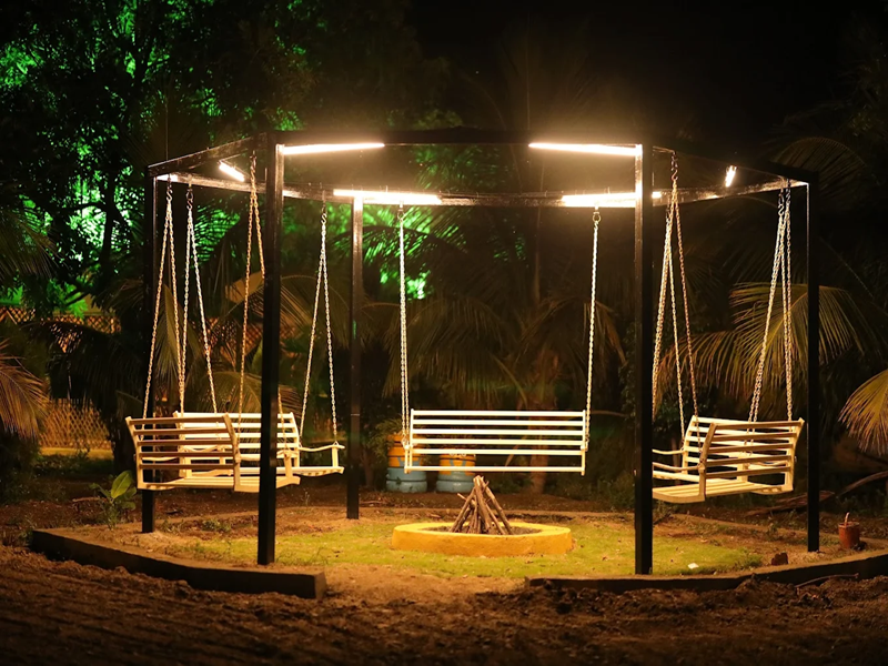 Families enjoying winter adventures, bonfires, and farm activities at the best agro resort in Shirdi