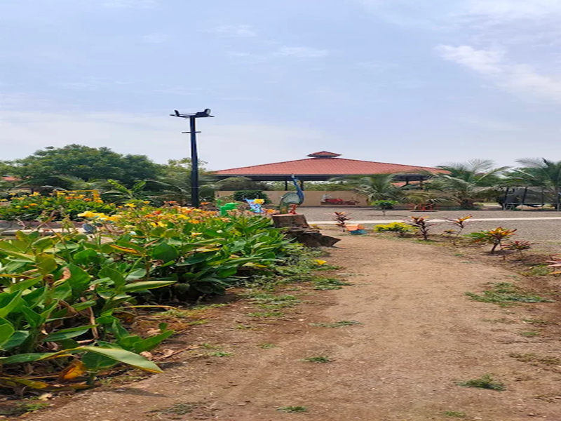 Family relaxing in natural surroundings at the Best Agro Resort in Shirdi