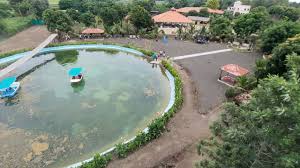 Families relaxing in peaceful surroundings at the Best Agro Resort in Shirdi