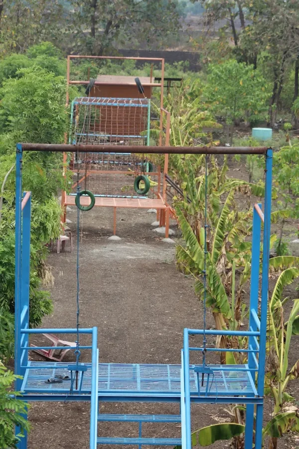 Visitors enjoying countryside views at the Best Agro Resort in Shirdi