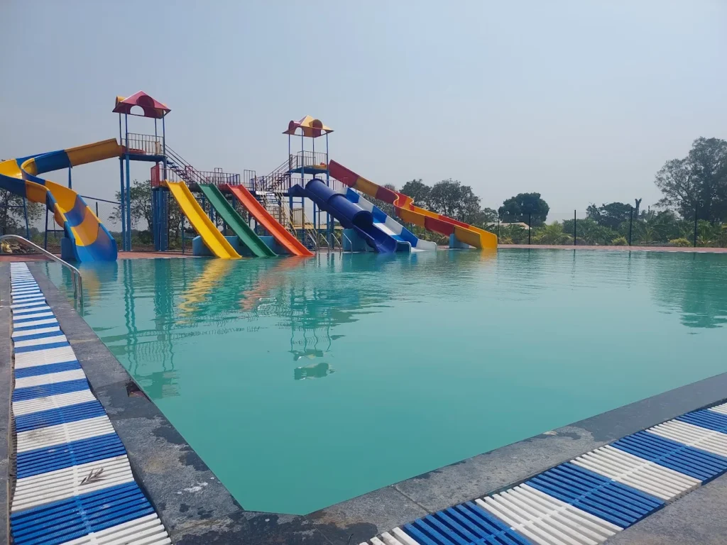 Visitors enjoying a relaxing countryside stay at the Best Agro Resort in Shirdi