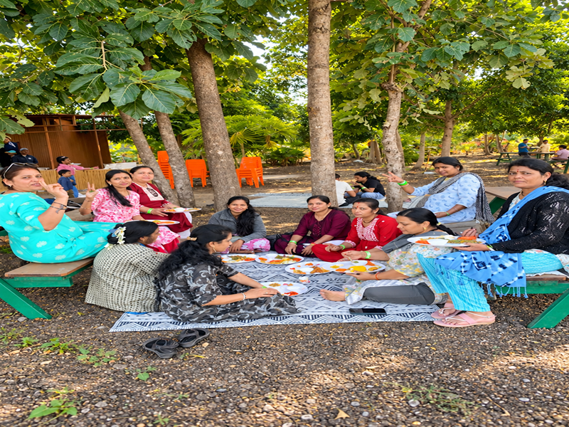 Family enjoying a peaceful nature day at the Best Agro Resort in Shirdi